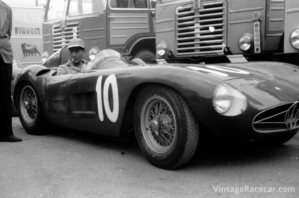 Luigi Musso acclimates himself to the cockpit of his Maserati 300S prior to the start of the 1955 Grand Prix of Bari.Photo: Maserati Archive 