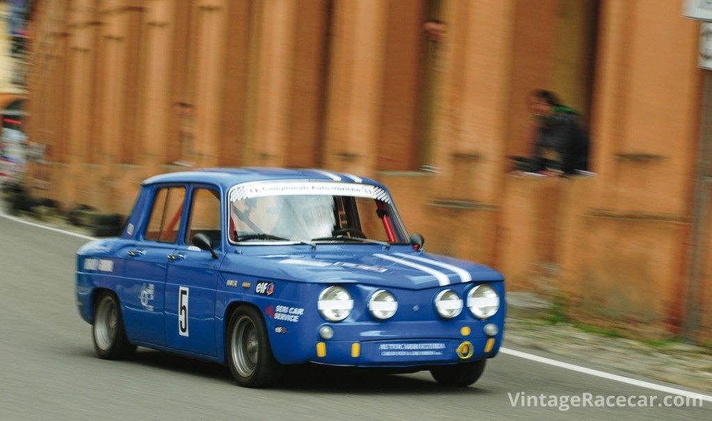 The R8 Gordini of Santo Coleschi speeds past the arcades that line the route and provide spectator perches.Photo: Peter Collins