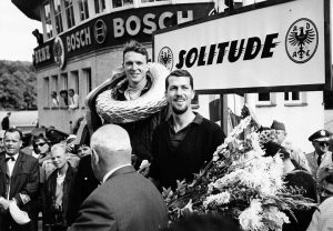  Porsche teammates Dan Gurney and Joakim Bonnier enjoy the chance to stand on the top two steps of the podium after running 1-2 at Solitude in 1962. Photo: Porsche