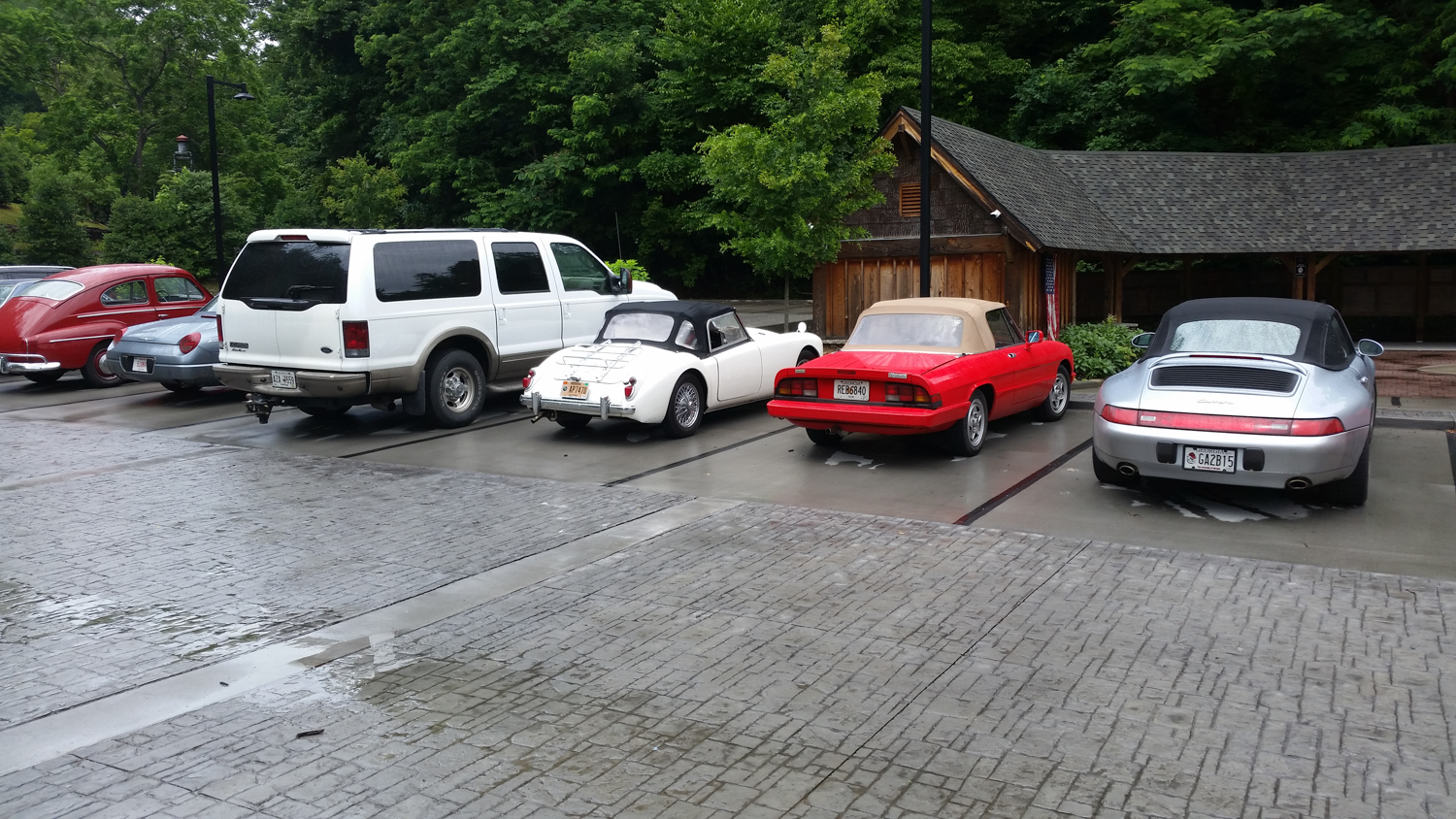 Parking at the Lodge for lunch. Not everyone drove their show car on the tour. The Ford Excursion was driven by a racer - you should see it in the hairpins. 