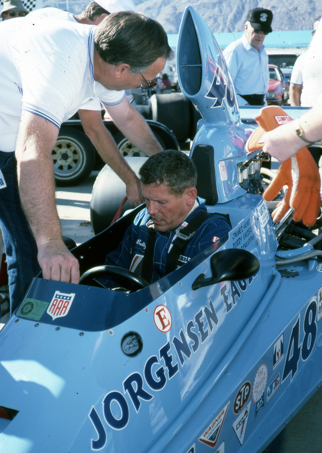 Bobby Unser drove the Indy-winning Eagle, then owned by Ron Kellogg (standing). 