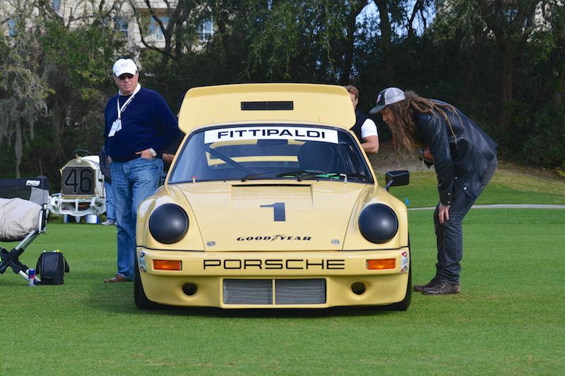 Magnus Walker inspects the 1974 Porsche 911 IROC RSR