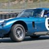 Rob Walton's 1965 Cobra Daytona Coupe accelerates out of turn Eleven.
