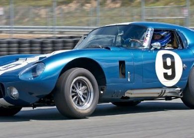 Rob Walton's 1965 Cobra Daytona Coupe accelerates out of turn Eleven.