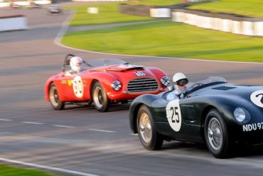 Stirling Moss in the Jaguar C-Type tries to stay clear of the Tojeiro-Bristol