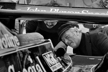Colin Chapman inspects the back of Mario Andretti's Lotus 79