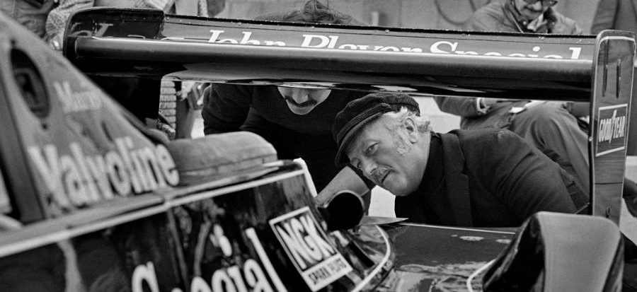 Colin Chapman inspects the back of Mario Andretti's Lotus 79
