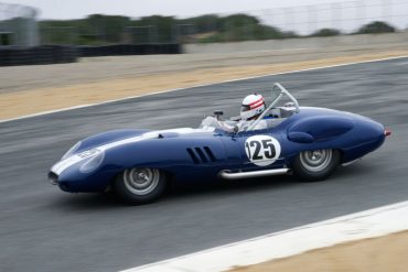 Erickson Shirley's 1959 Lister Costin Chevrolet enters The Corkscrew. DennisGray