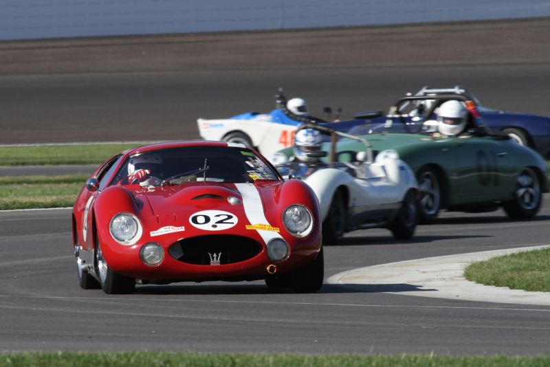 Charles Schwimer, 65 Maserati Tipo 151 ahead of a diverse group of racers. Picasa