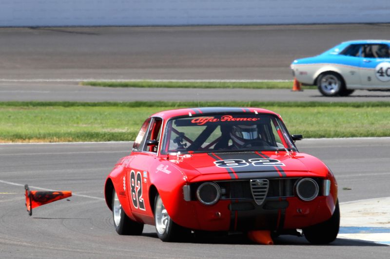 Bill Abel, 66 Alfa Romeo GTV discarding one of the cones he collected. Picasa