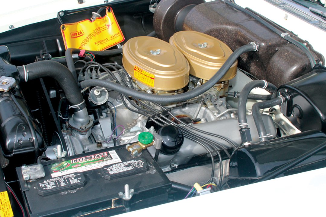 Engine bay of a 1958 white DeSoto Adventurer