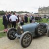 Bugatti Type 35B with the stunning Chateau de Chantilly in the background.