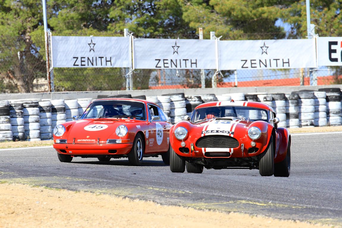 The 1963 AC Cobra 289 sneaks by the 1965 Porsche 911 Coupe