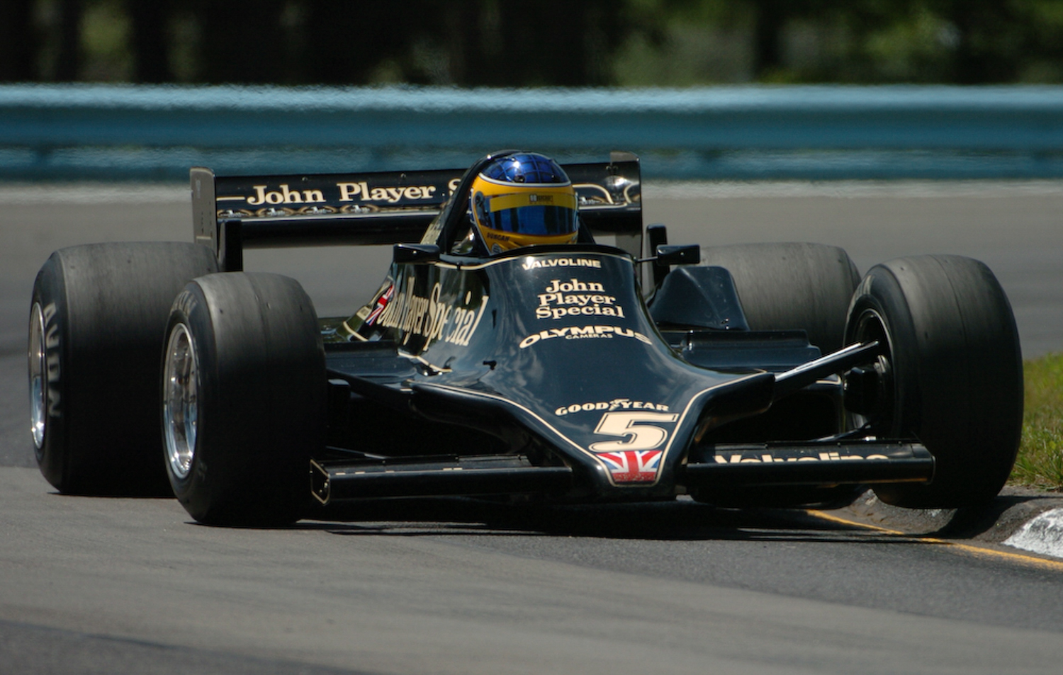 Duncan Dayton, rides up on the curbing in Mario Andretti's 1978 Lotus 79.