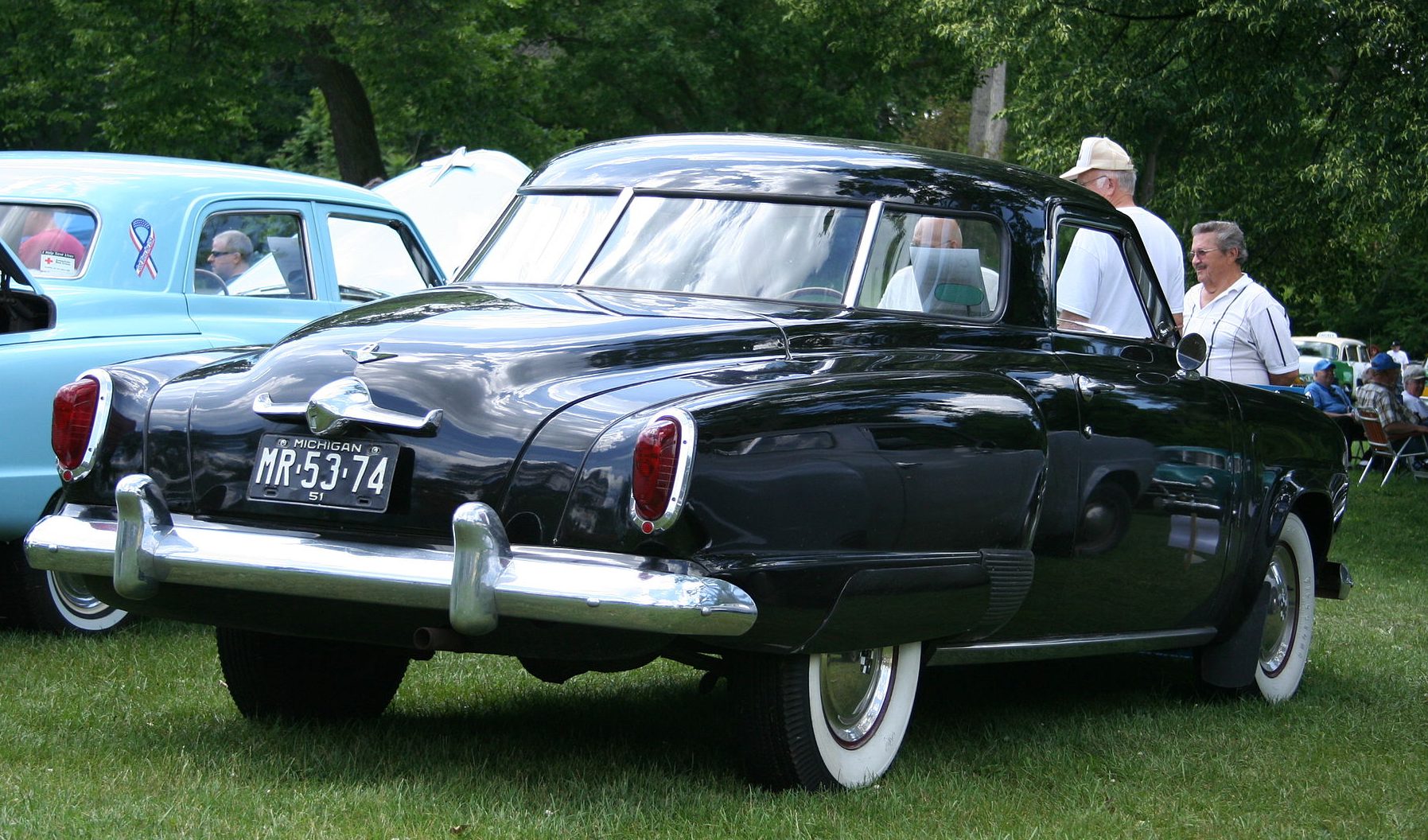  Three-quarter rear view of a black 1947 Studebaker Starlight Coupe