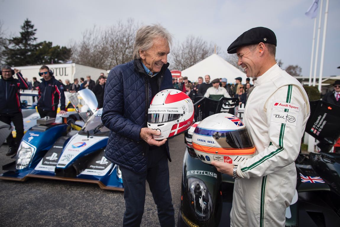 Le Mans legends Derek Bell and Tom Kristensen swap helmets- Photo: Drew Gibson Drew Gibson