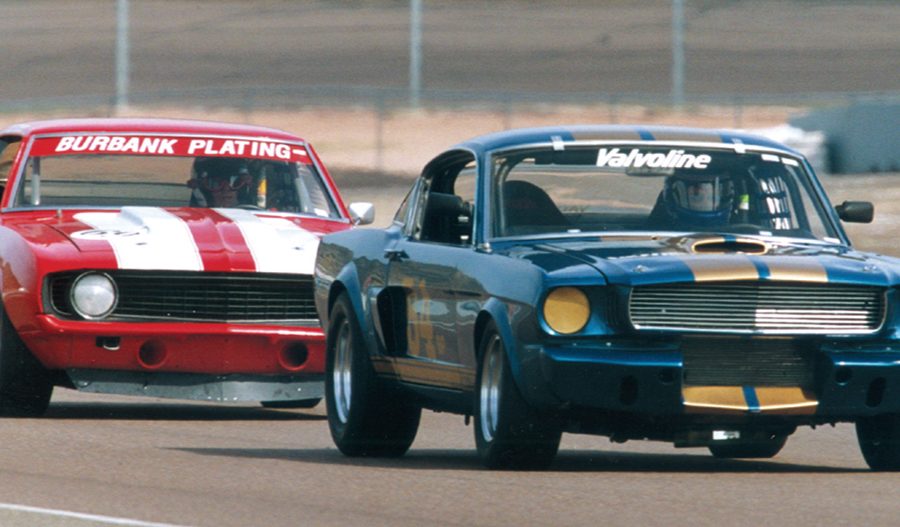 The Shelby GT350 of Jim Click leads the Camaro of Bob Scheer.