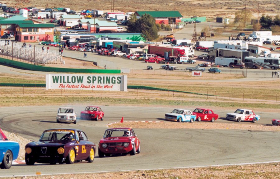 The 20-plus car field charges through turns 3 & 4 on the opening lap.