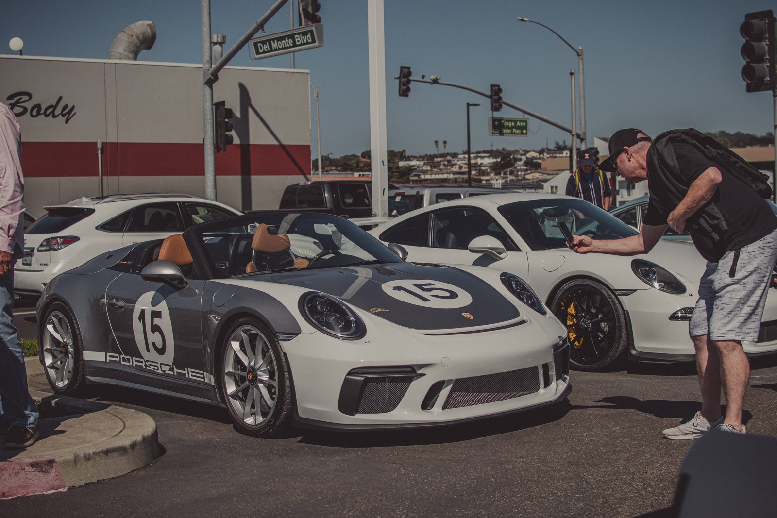 An attendee at the Porsche Monterey Classic gets a phone snap of a new Porsche Speedster