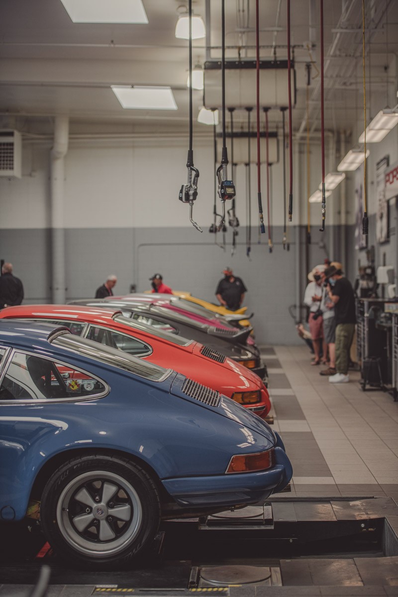 A 'Rennbow' of Porsches lined up in the service bay