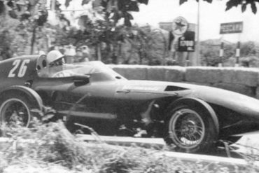 Stirling Moss drives a Vanwall to victory in the Pescara Grand Prix (1957).