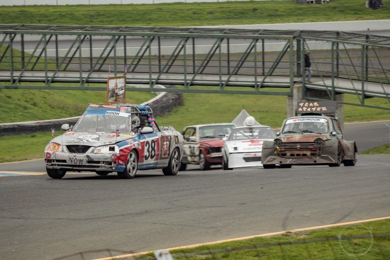 Team Another Fine Mess takes the lead in Turn 2 during the 24 HR of LeMons