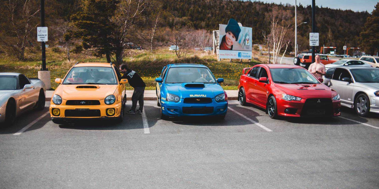 Subaru Imprezas and a Lancer Evolution on a Car Meet