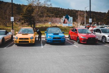 Subaru Imprezas and a Lancer Evolution on a Car Meet