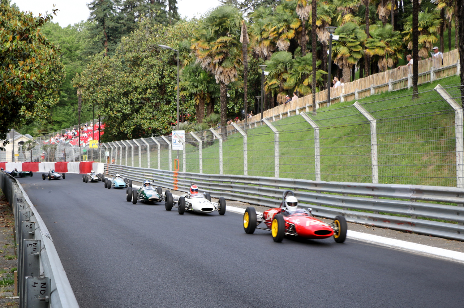 FORMULA JUNIOR FIELD STREAMS UP THE HILL AFTER THE START. Picasa