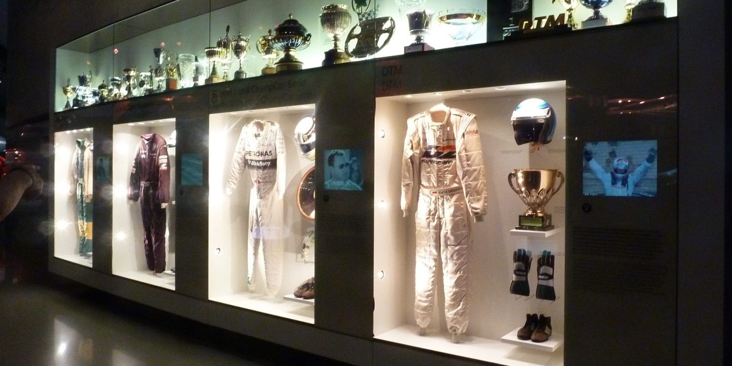 Display of racing apparel at Mercedes-Benz museum in Germany