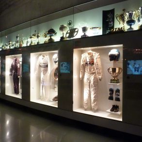 Display of racing apparel at Mercedes-Benz museum in Germany