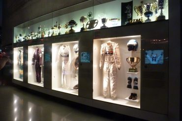 Display of racing apparel at Mercedes-Benz museum in Germany