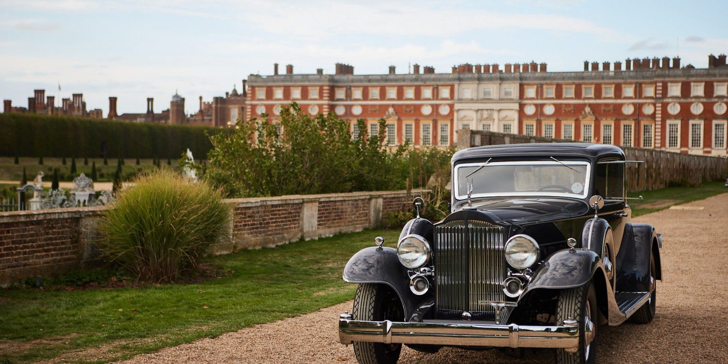 Packard Twelve in front of Hampton Court Palace.