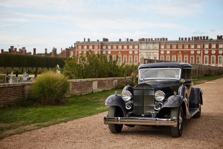 Packard Twelve in front of Hampton Court Palace.