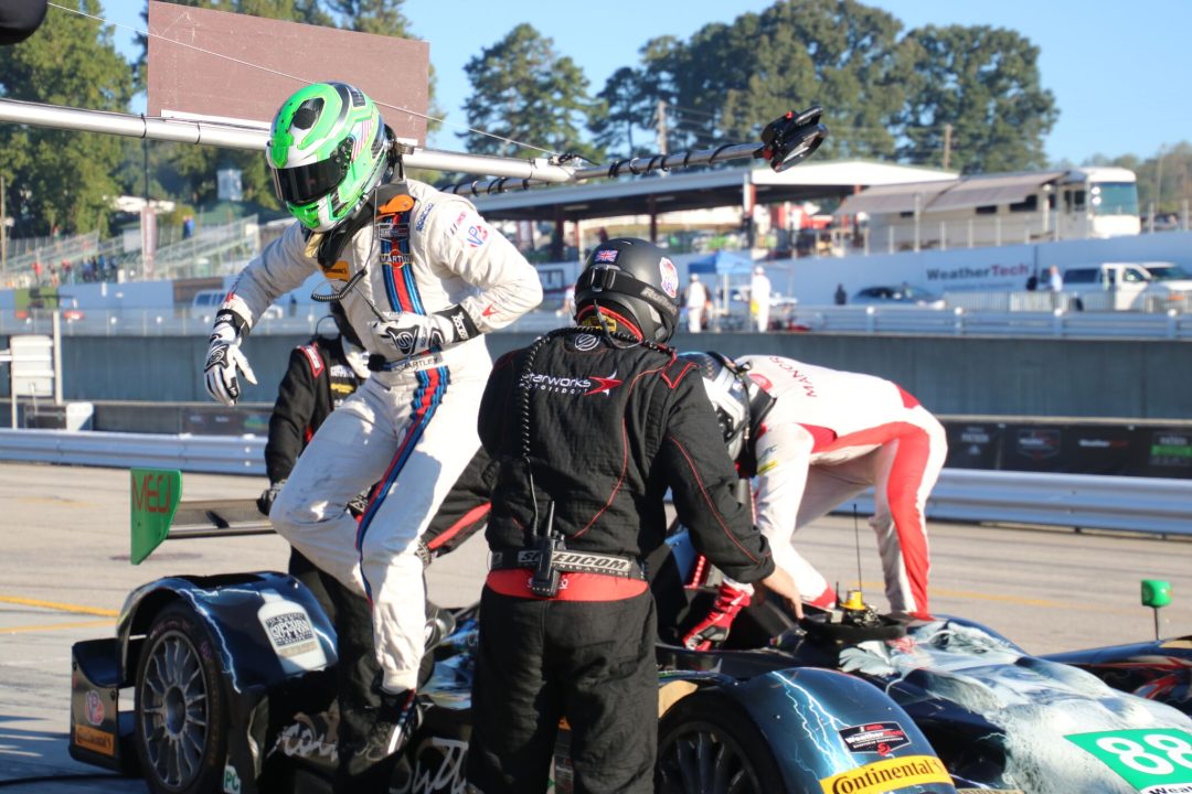 max hanratty exiting the car during a pit stop
