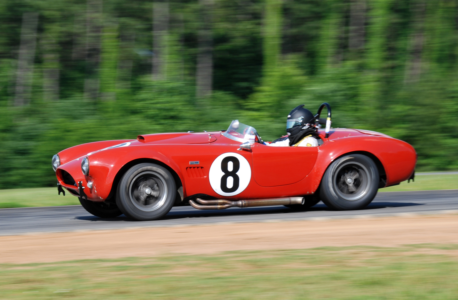 Lorne Leibel accelerates down the back straight in his 1964 Shelby Cobra 289. 