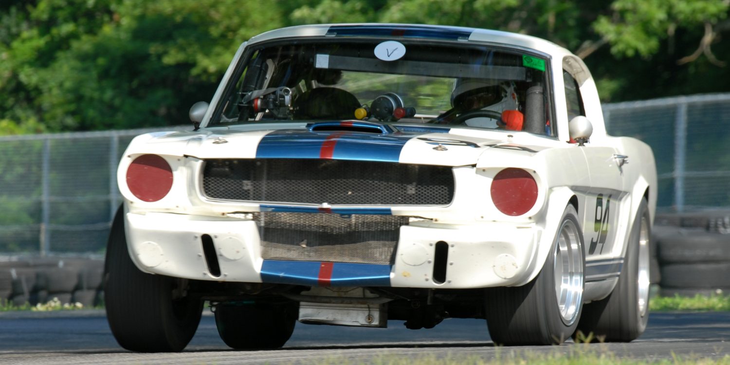 Brian Kennedy powers out of the Oak Tree turn in his 1966 Shelby GT350.