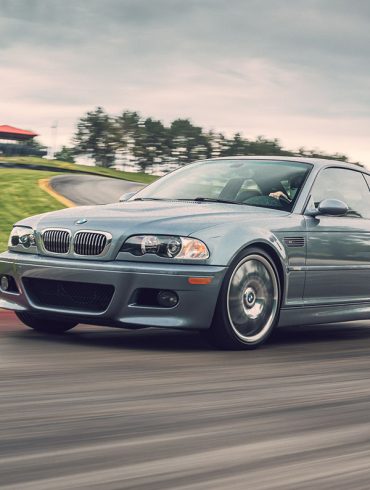 Silver BMW M3 E46 on a racetrack