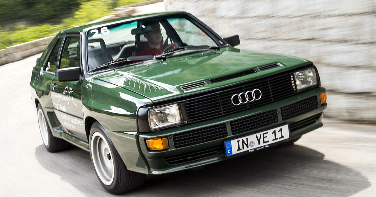 Photo of a green Audi sport quattro on a curvy road