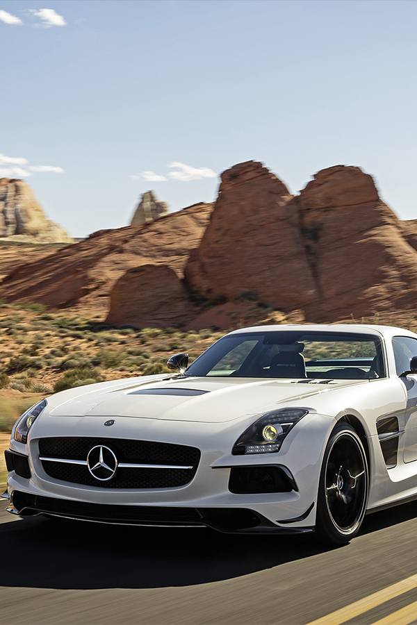 2014 white SLS AMG Black Series on a desert road