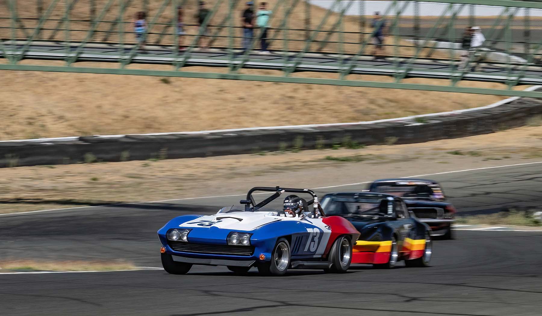 AC D'Augustine's 1965 Corvette leads up the hill into turn two. Dennis Gray;Dennis Gray