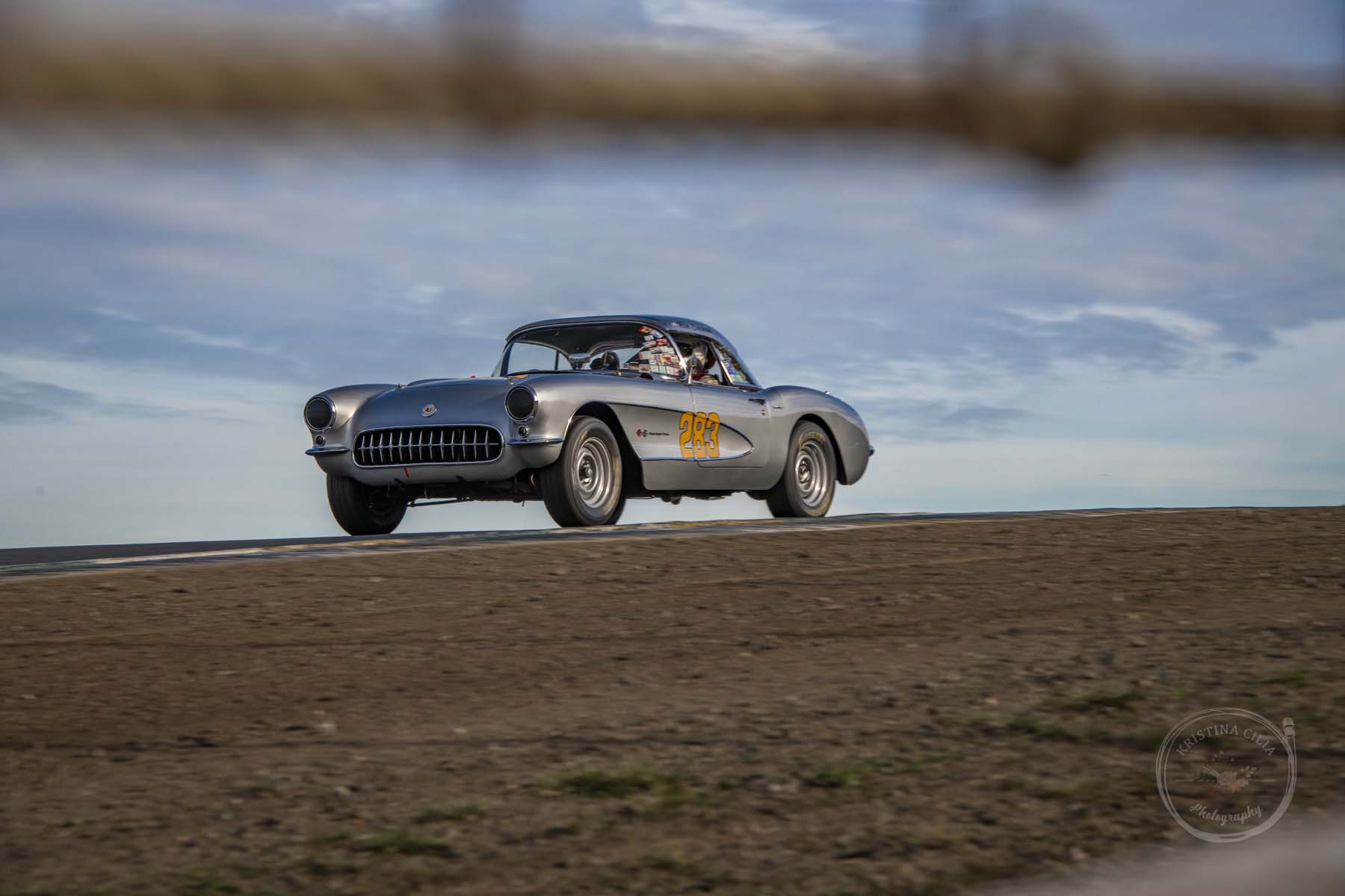 Ron Erickson crests the hill in a 1957 Chevrolet Corvette before going down  into Turn 4 at Sonoma Raceway