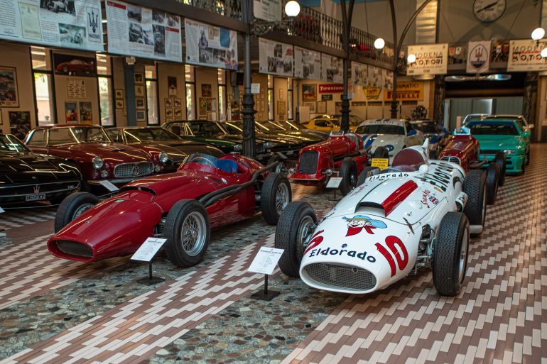 Greeting visitors to the Umberto Panini Motor Museum Collection, are: (left) 1957 Maserati 250 F - 2,500 cc V12 engine; and (right) 1958 Maserati 420M ‘Eldorado Special’ - 4,190 cc V8 engine. © Glen Smale