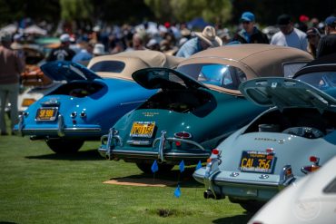 A variety of Porsche 356's line the show field