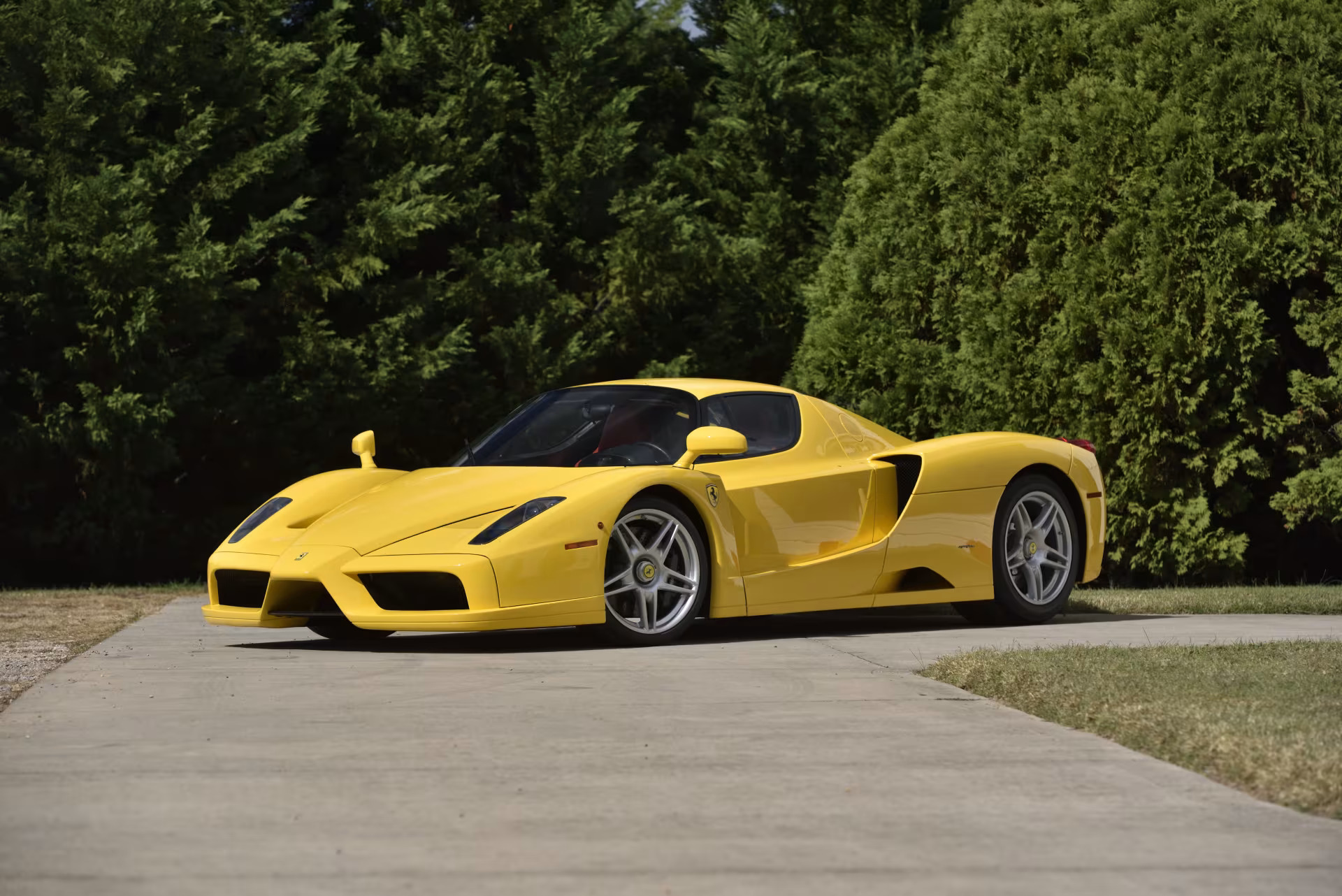 Three-quarter side view of a 2003 Ferrari Enzo in Giallo Modena from the Bachman Ferrari Collection