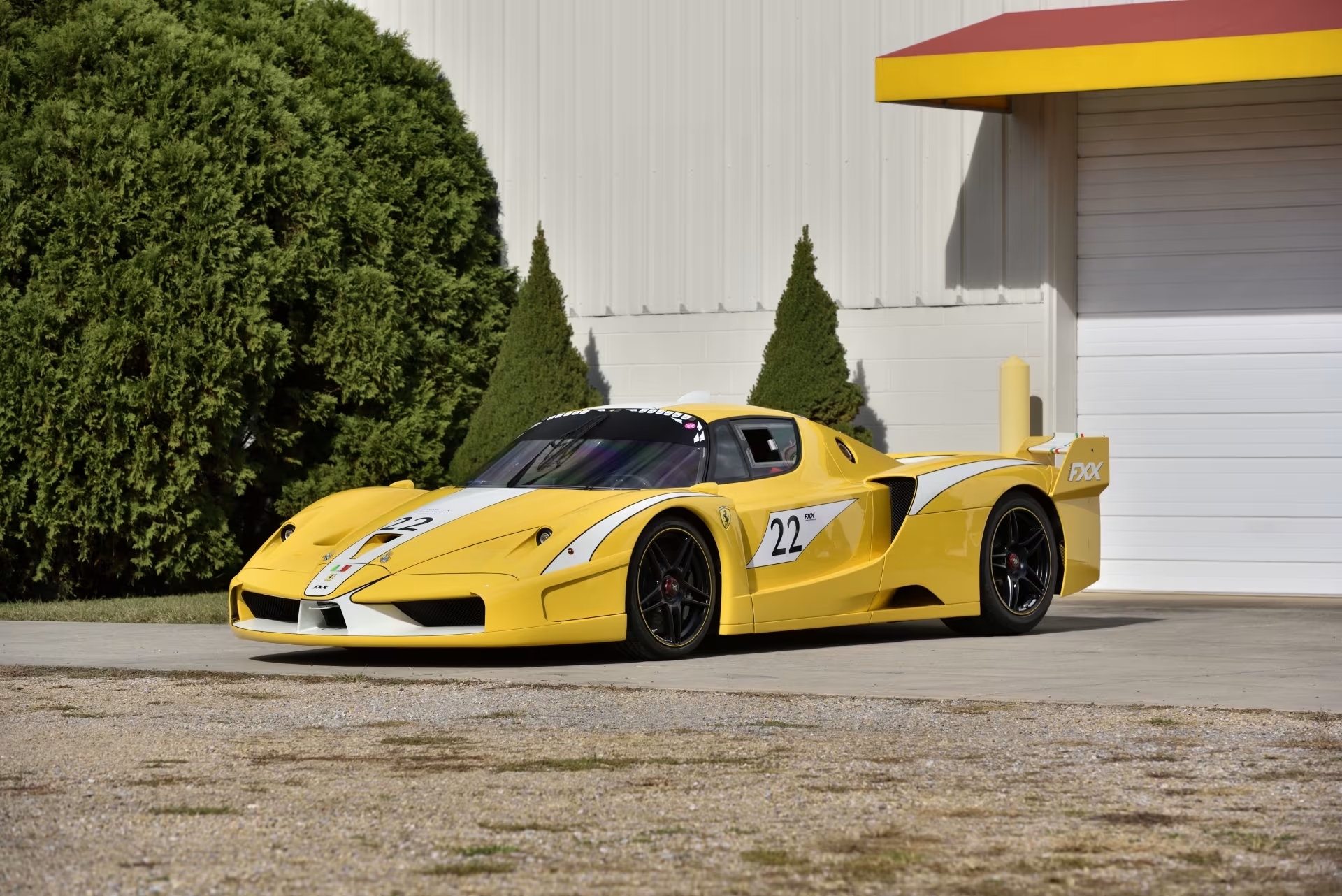 Three-quarter side view of a 2006 yellow Ferrari FXX from the Bachman Ferrari Collection