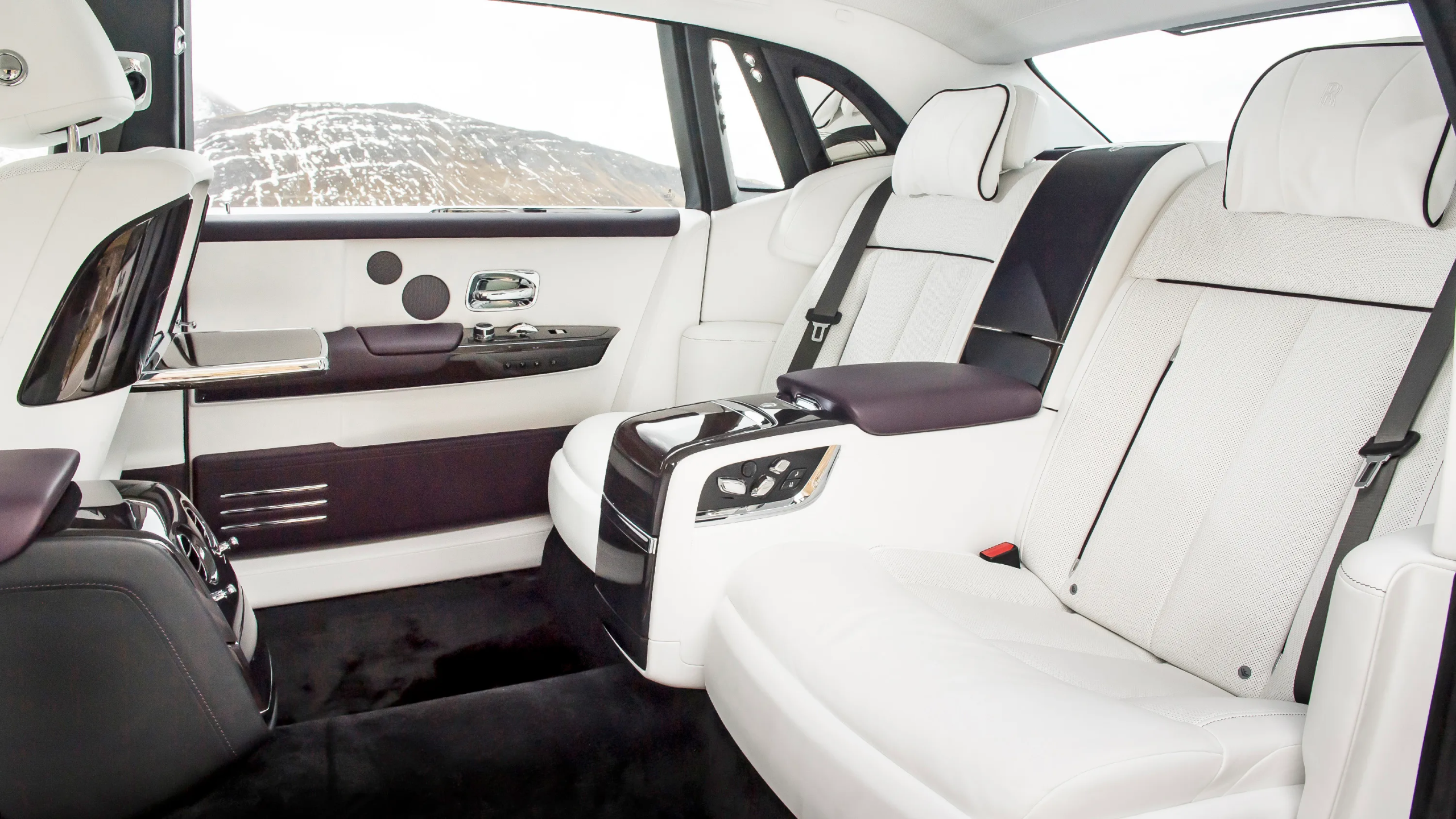 2026 Rolls-Royce Phantom rear cabin, showcasing spacious seating and handcrafted luxury materials.