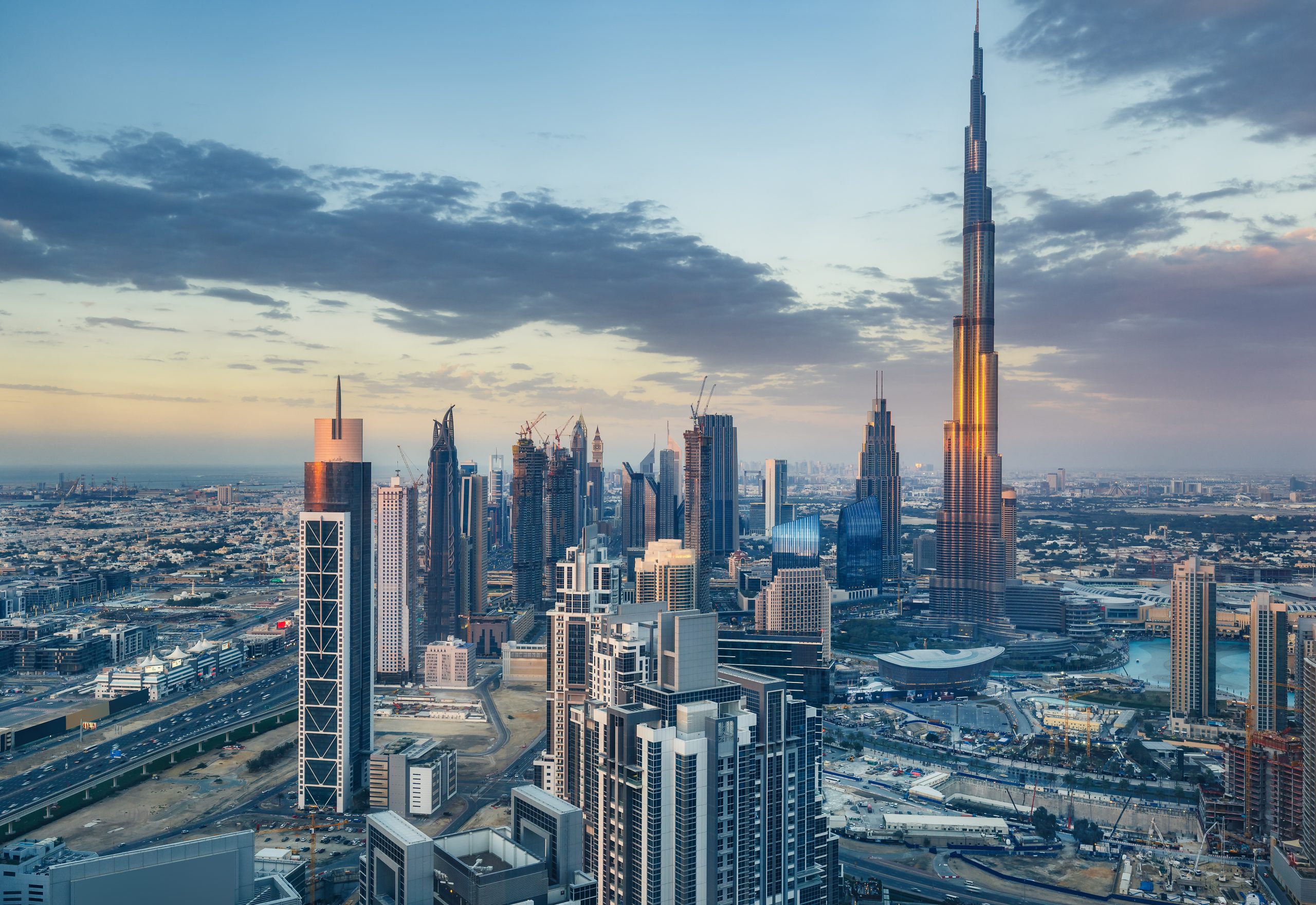 Dubai skyline at sunset, featuring the Burj Khalifa and the city’s modern high-rise architecture