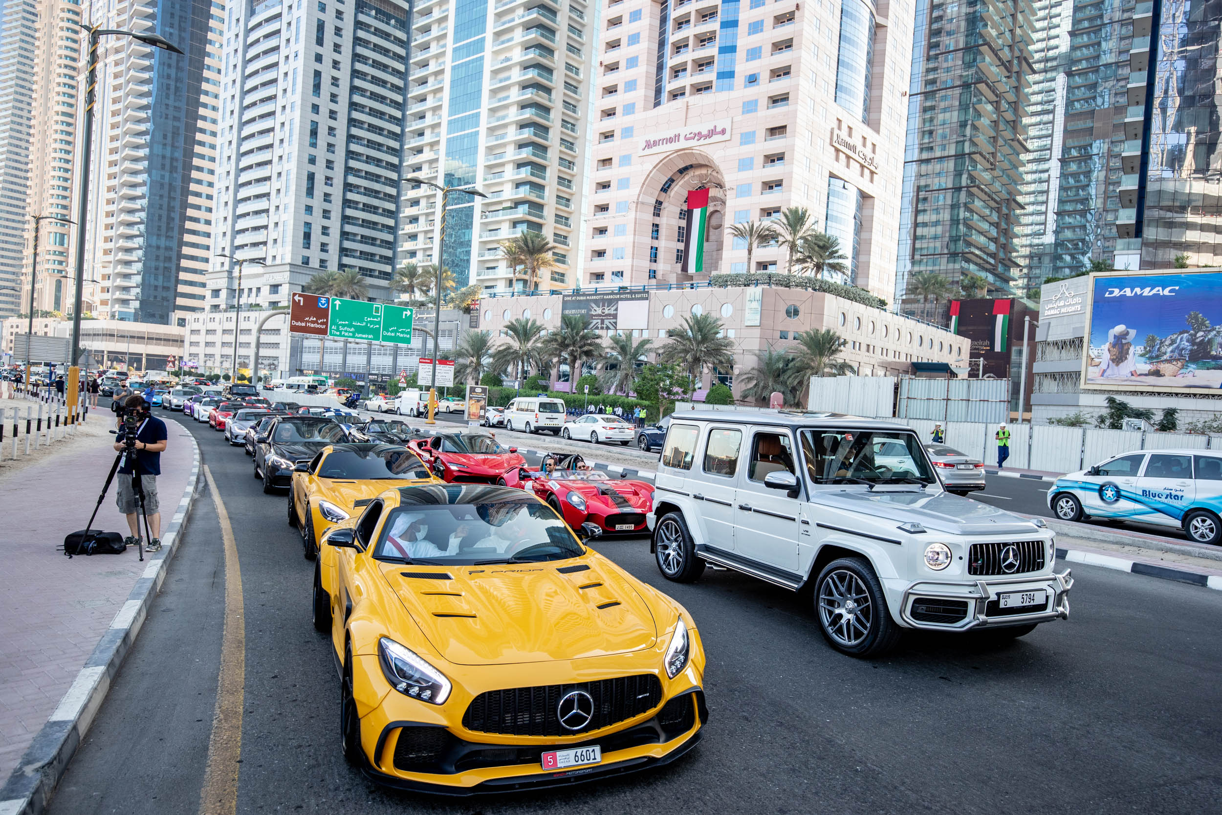 Luxury supercars driving through Dubai’s city streets