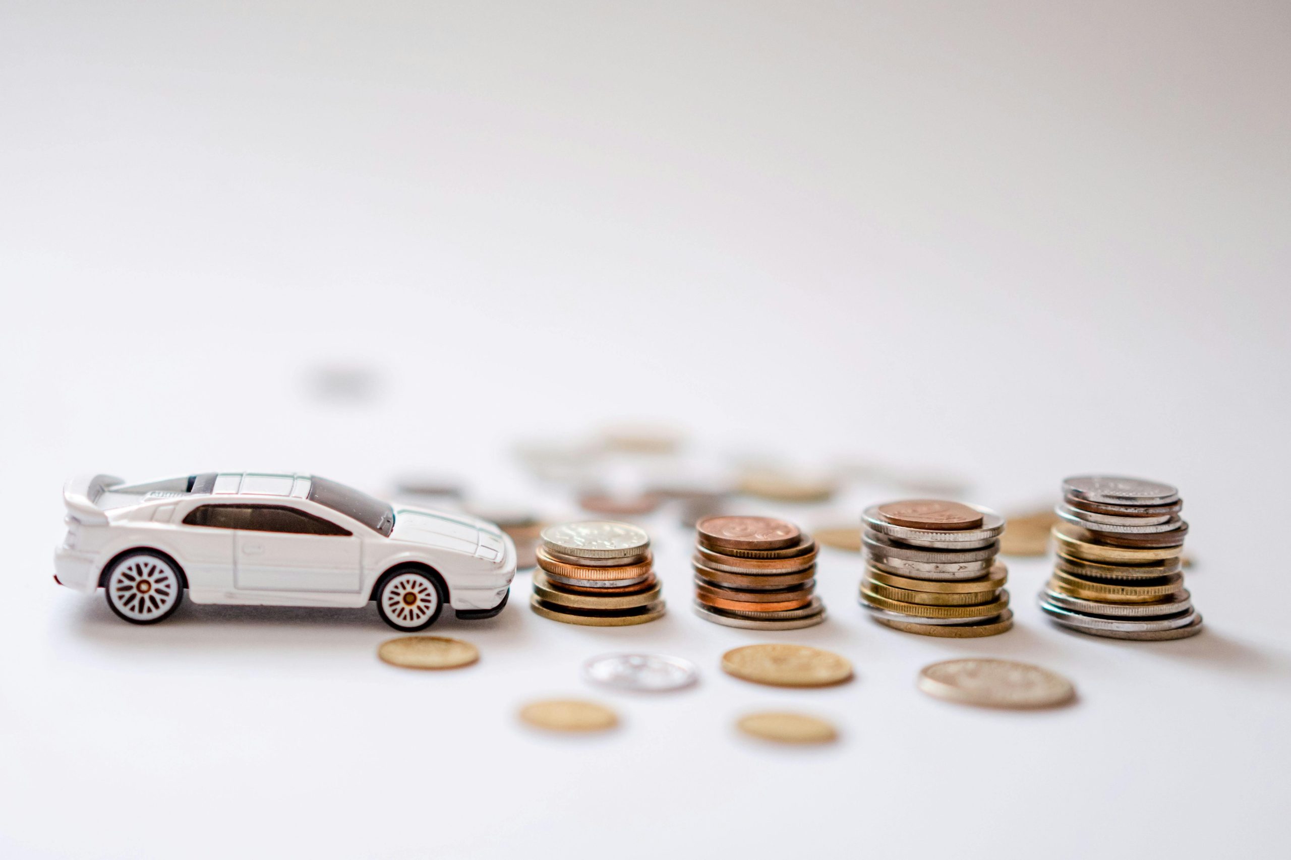 Lotus Esprit car toy next to coins